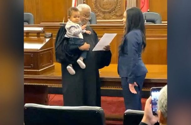 Judge holds baby as mom is sworn in as lawyer