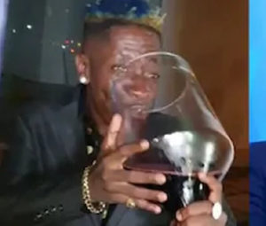 VIDEO: Shatta Wale causes stir for drinking from huge wine glass