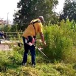 VIDEO: Mahama grabs mower, clears weeds in front of new military cemetery