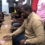 VIDEO: John Dumelo spotted playing cards with fans in his hood