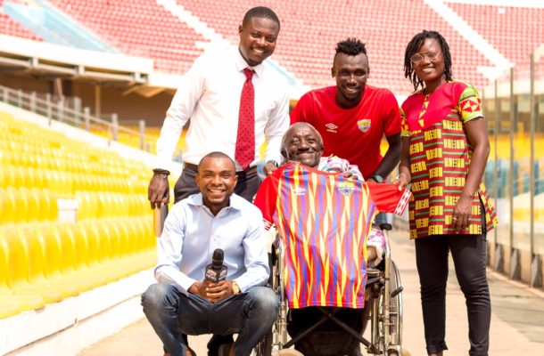PHOTOS & VIDEO: Emmanuel Nettey presents signed Hearts jersey to physically challenged fan