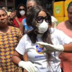 Gospel musician distributes hand sanitizers to market women