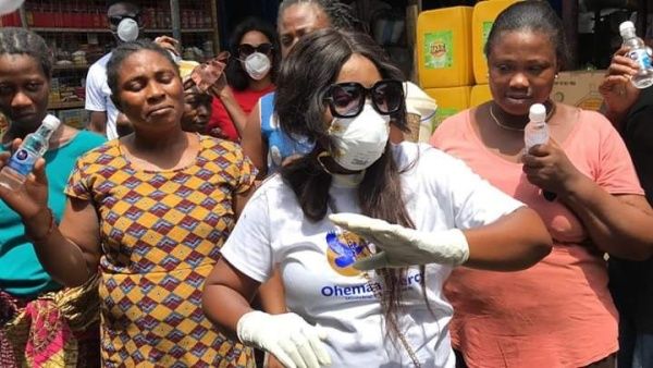 Gospel musician distributes hand sanitizers to market women