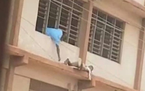 ‘Spiderman’ sneaks WASSCE answers to students on top floor with ladder