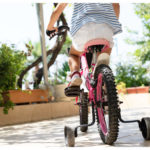 I am in no hurry to remove the training wheels from my 9-year-old daughter’s cycle