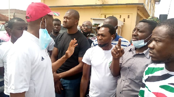 Asawase MP, NDC supporters storm police station, chant for release of 10 colleagues