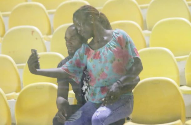 GPL: Couples 'chop' love in the stands during Legon Cities vs Kotoko game