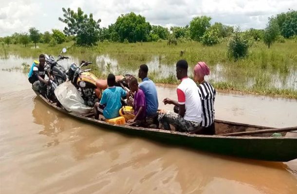 Pregnant women access health care with canoe after rains in North East Region