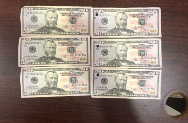 Two arrested for trading with fake dollars