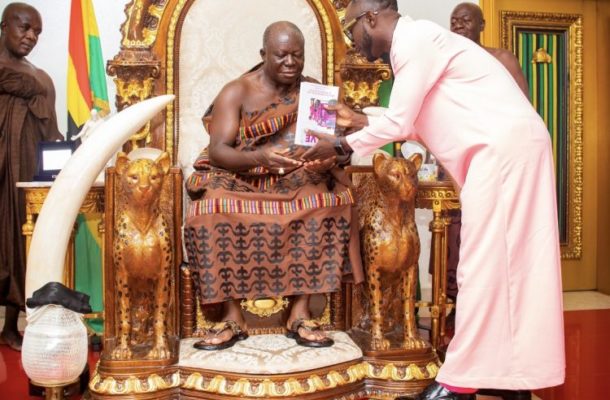 Okyeame Kwame presents his ‘Love Locked Down’ book to Asantehene