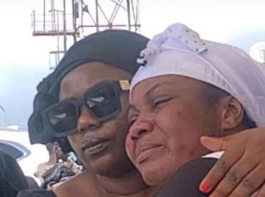 Empress Gifty sheds tears at burial of her grandma and sister