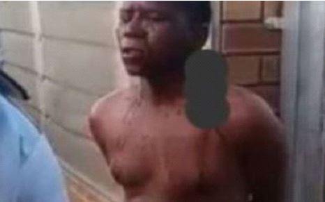 Headmaster tied to a pole naked;  Beaten by mob after he was caught chopping his student (Video)