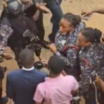 Slain immigration officer's family attacks lawyer, suspects in court