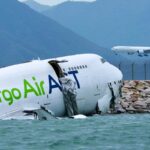 Emirates cargo plane slides off Hong Kong runway, killing 2 ground crew