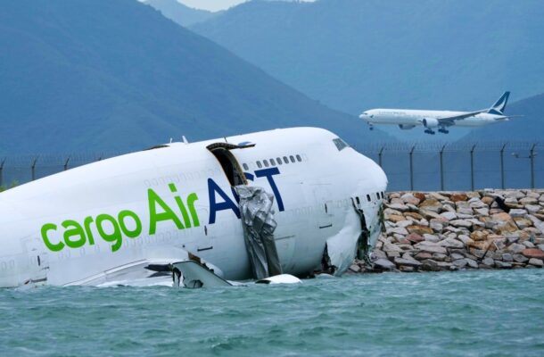 Emirates cargo plane slides off Hong Kong runway, killing 2 ground crew