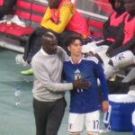 Japan midfielder Ao Tanaka apologises to Otto Addo after Abu Francis' injury